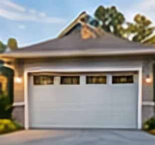 White garage door on a house with blue siding
