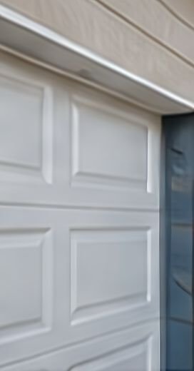 Close-up of white raised garage door panels